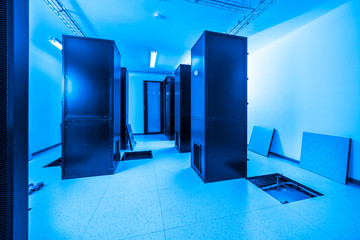 server cabinets inside data center room