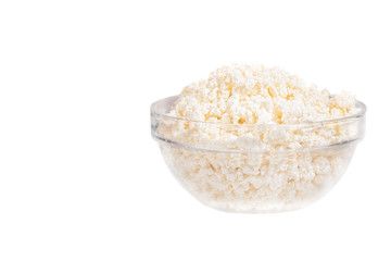 Fresh cottage cheese (curd) in glass bow, isolated on white back