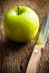 green apple with knife