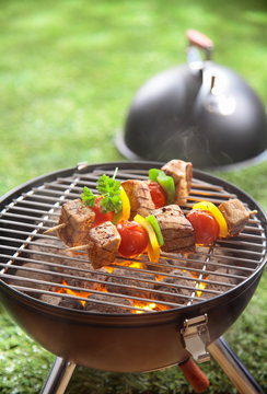 Healthy beef kebabs grilling over a fire