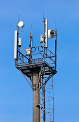 Fototapeta na wymiar A radio communications tower against blue sky