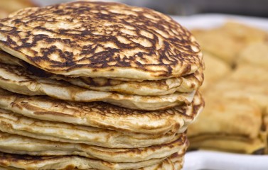Shrovetide pancakes on a festive table