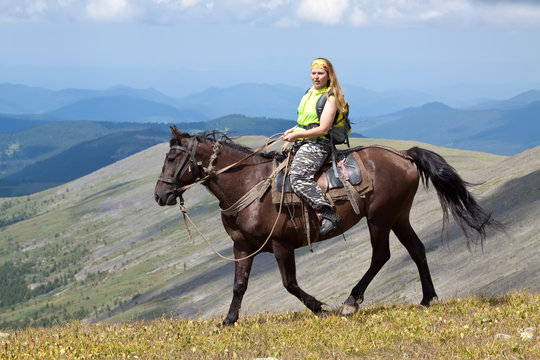  rider with backpack on horseback