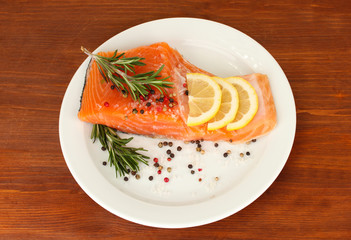 Fresh salmon fillet with herbals and lemon slices