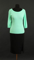Turquoise blouse and black skirt