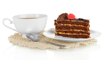 A cup of tea and delicious cake isolated on white