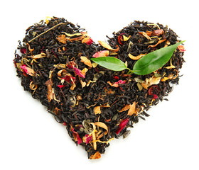 Dry black tea with green leaves, isolated on white