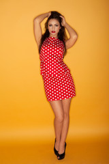Retro model in a polka dot dress
