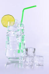 Ice in a glass isolated on white