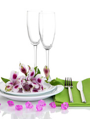 Festive table setting with flowers isolated on white