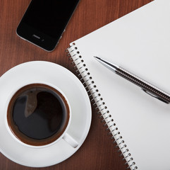 Obraz na płótnie Canvas coffee with blank notebook and phone