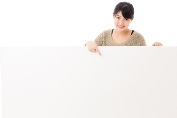 a young asian woman with blank whiteboard