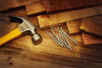 Hammer, nails and wood. Carpentry still life