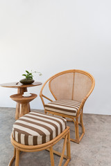 Beautiful bamboo rattan furniture in front of a white wall