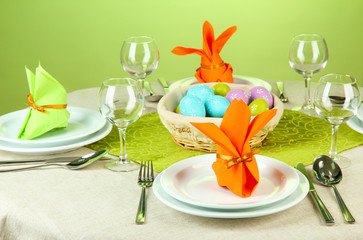 Easter table setting on color background