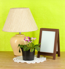 Brown photo frame and lamp