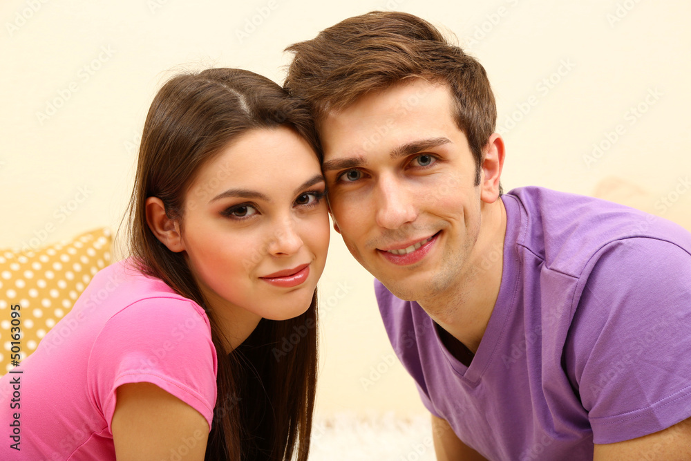 Wall mural Young couple at home