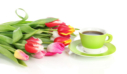 Beautiful tulips in bucket with cup of tea isolated on white