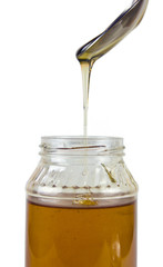 HONEY DRIPPING FROM SPOON