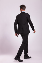 back view of business man walking