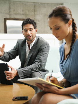 Business people working together in lobby