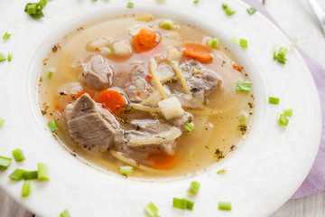 meat soup with noodles and vegetables