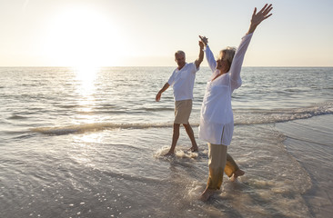Happy Senior Couple Holding Hands Sunset Sunrise Beach - obrazy, fototapety, plakaty