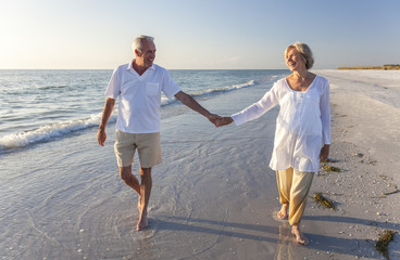 Happy Senior Couple Walking Holding Hands Tropical Beach - obrazy, fototapety, plakaty