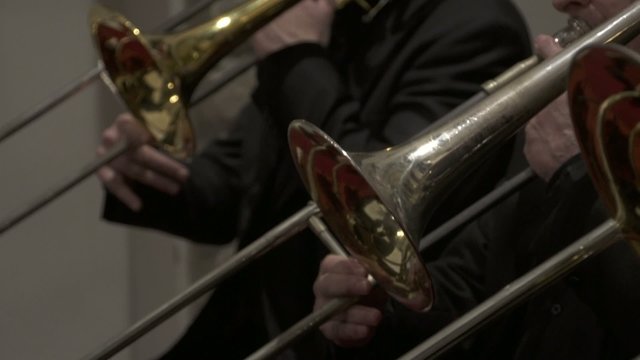 Trombone players performing