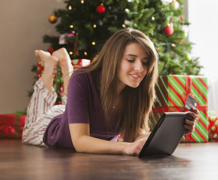 Caucasian woman using digital tablet at Christmas time
