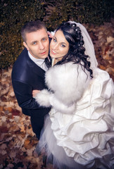 Wedding shot of bride and groom in park