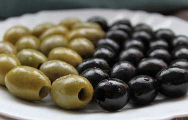 Yin and yang made from black and green olives