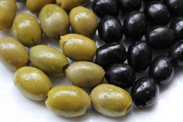 Closeup picture of green and black olives