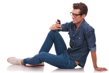 man on the floor texting