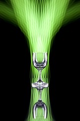 Glass of alcohol on disco background, party