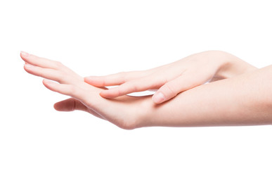 Woman rubs hand cream