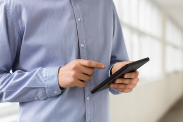 Businessman holding tablet pc