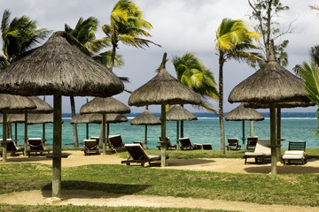 Fototapeta na wymiar Tropical resort with parasols on Mauritius.