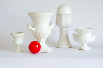 still-life with white vases and red billiards ball