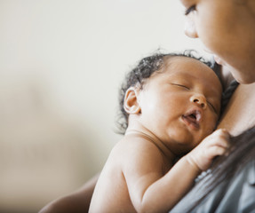 Mother holding newborn baby