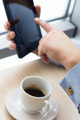 Businessman relaxing during coffee break at workplace