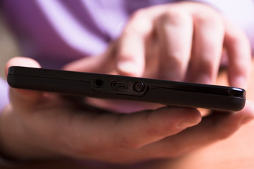 A man holds up and running on a Tablet PC