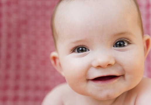Close up of smiling Caucasian baby girl