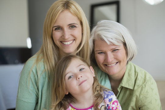 Smiling Caucasian grandmother, mother and daughter