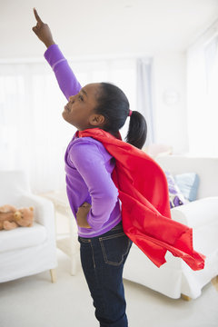 Black girl pretending to be a superhero