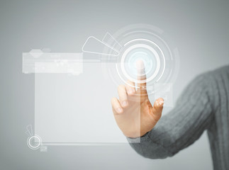man pressing virtual button