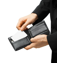 man in suit holding credit card