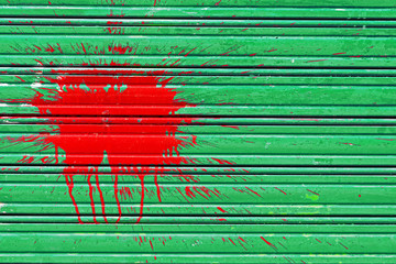 paint splotch on metallic gate due to vandalism