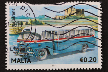 Malta: circa 2011: stamp shows image of classic blue Maltese bus