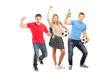 A group of young football supporters cheering